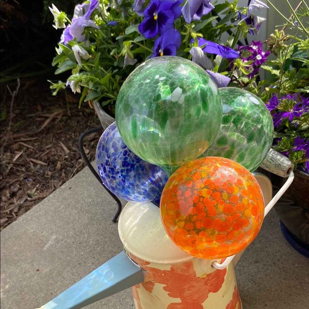 Green, Orange, and Blue Glass Globes